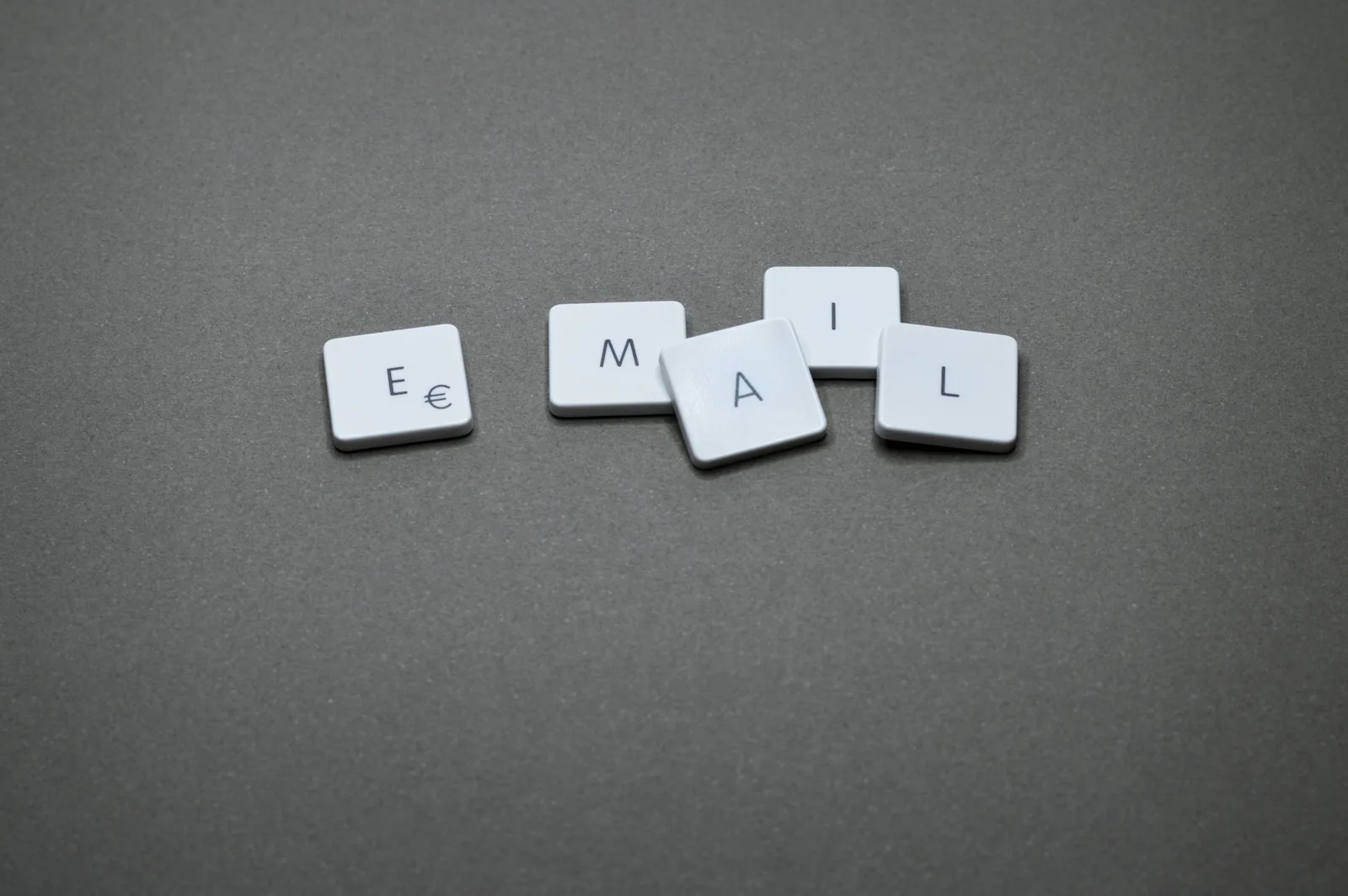 Close-up of the word 'email' formed with letter tiles on a gray surface. Where nonprofit email marketing goes from here: what to know first